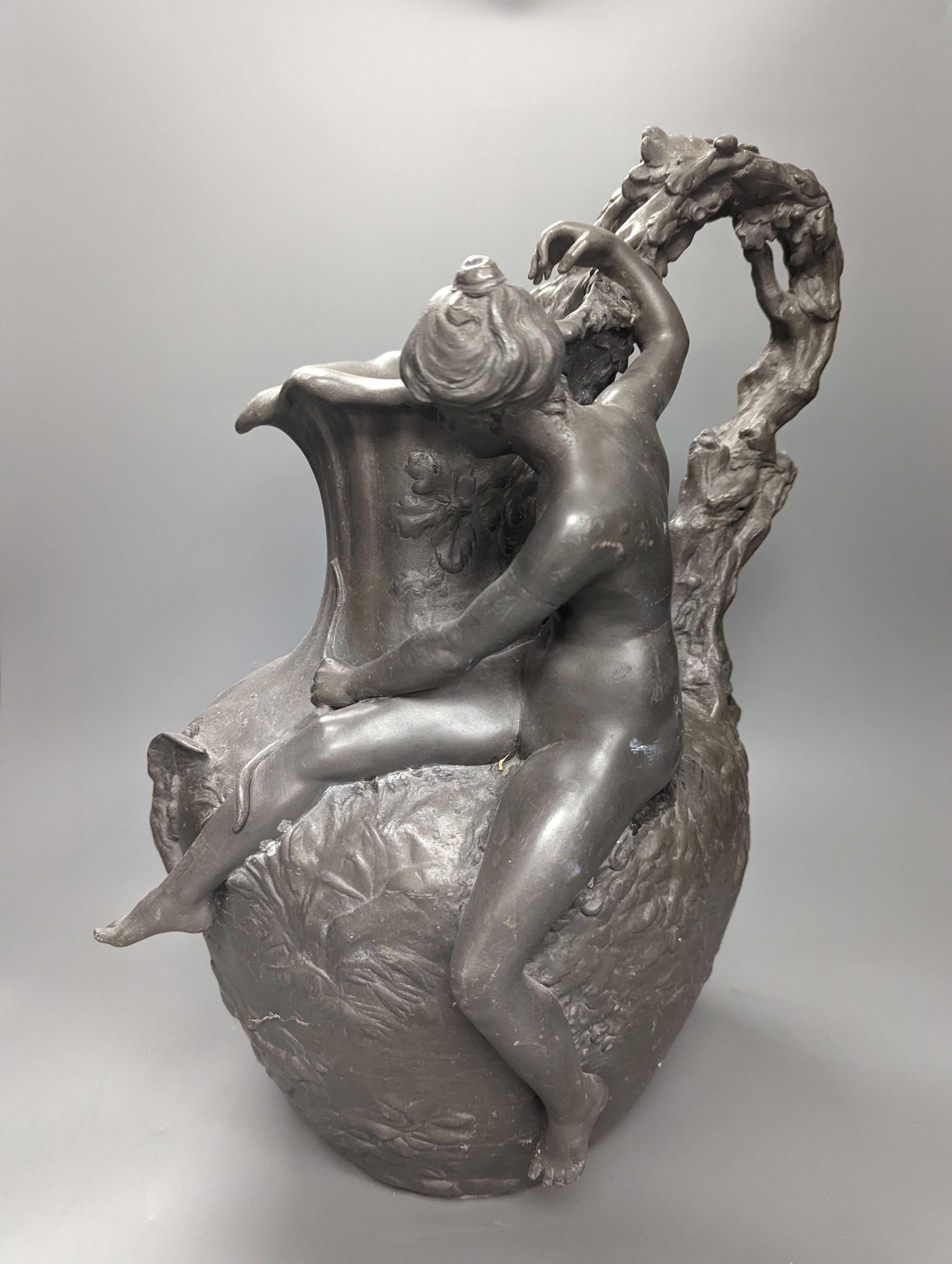 A heavy cast pewter figural ewer, in Art Nouveau style, based on a model by A. Vibert, unsigned, height 45cm